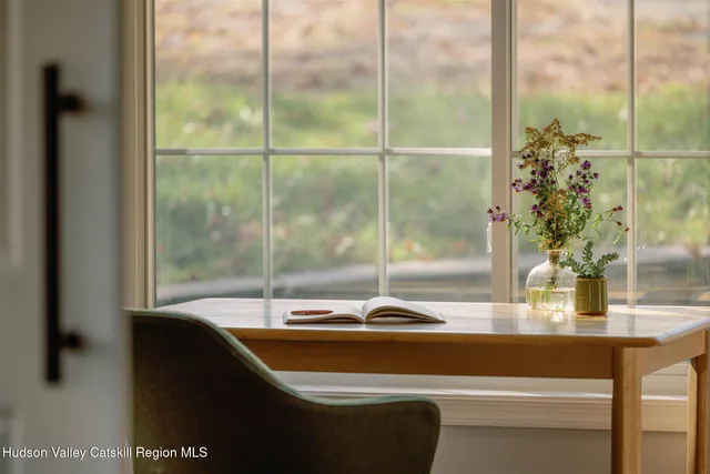 a room with a table and chairs