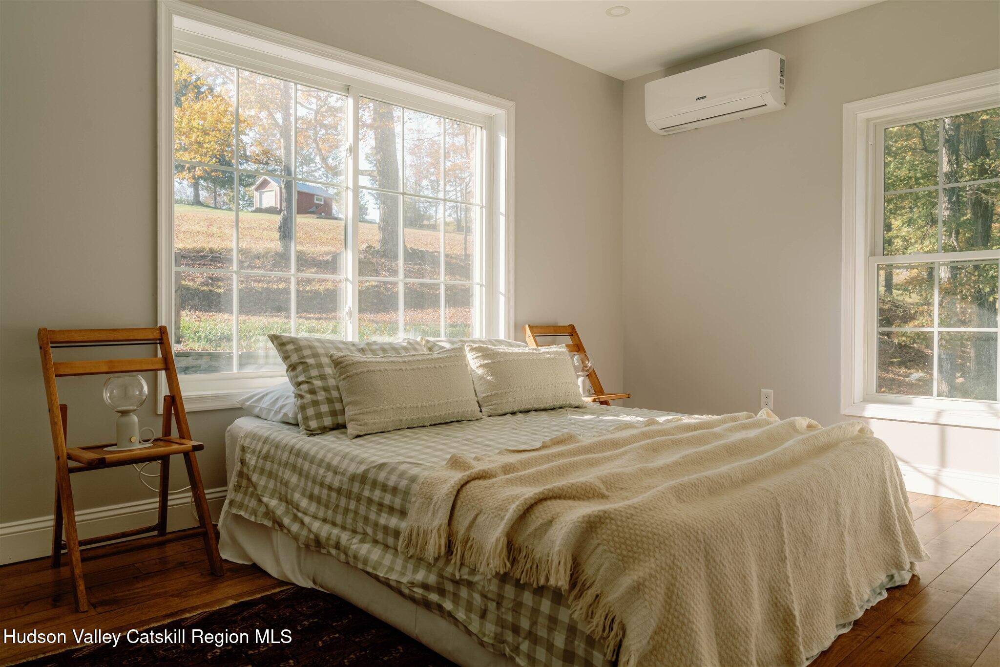 321 Mutton Hill Road Neversink, NY 12765 - Photo 20 of 25 a bedroom with a bed and a window