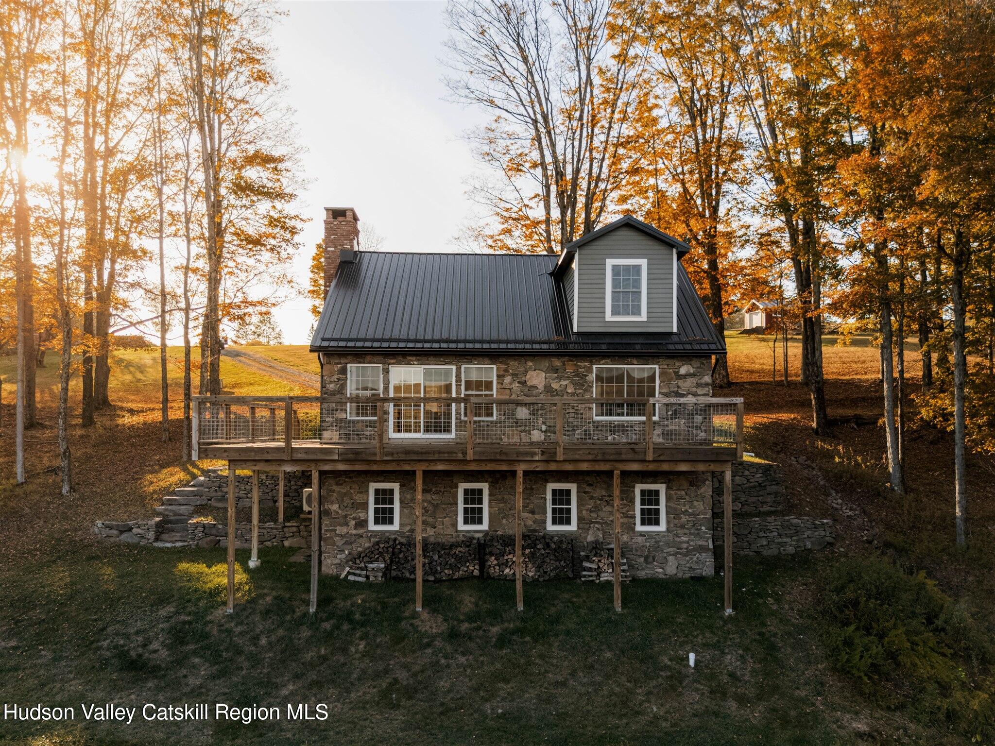 321 Mutton Hill Road Neversink, NY 12765 - Photo 24 of 25 a backyard of a house with table and chairs