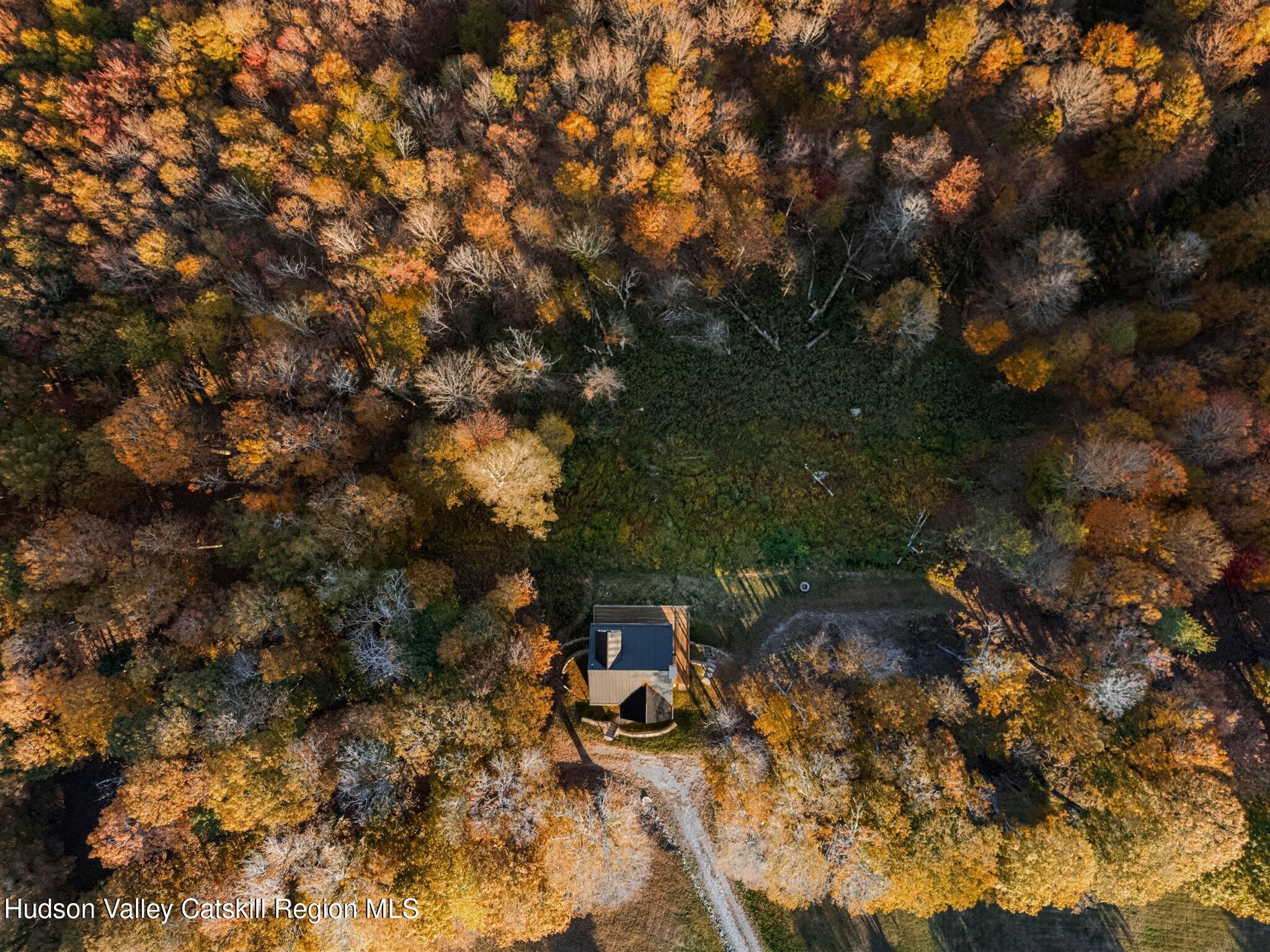 321 Mutton Hill Road Neversink, NY 12765 - Photo 25 of 25 a backyard of a house with table and chairs