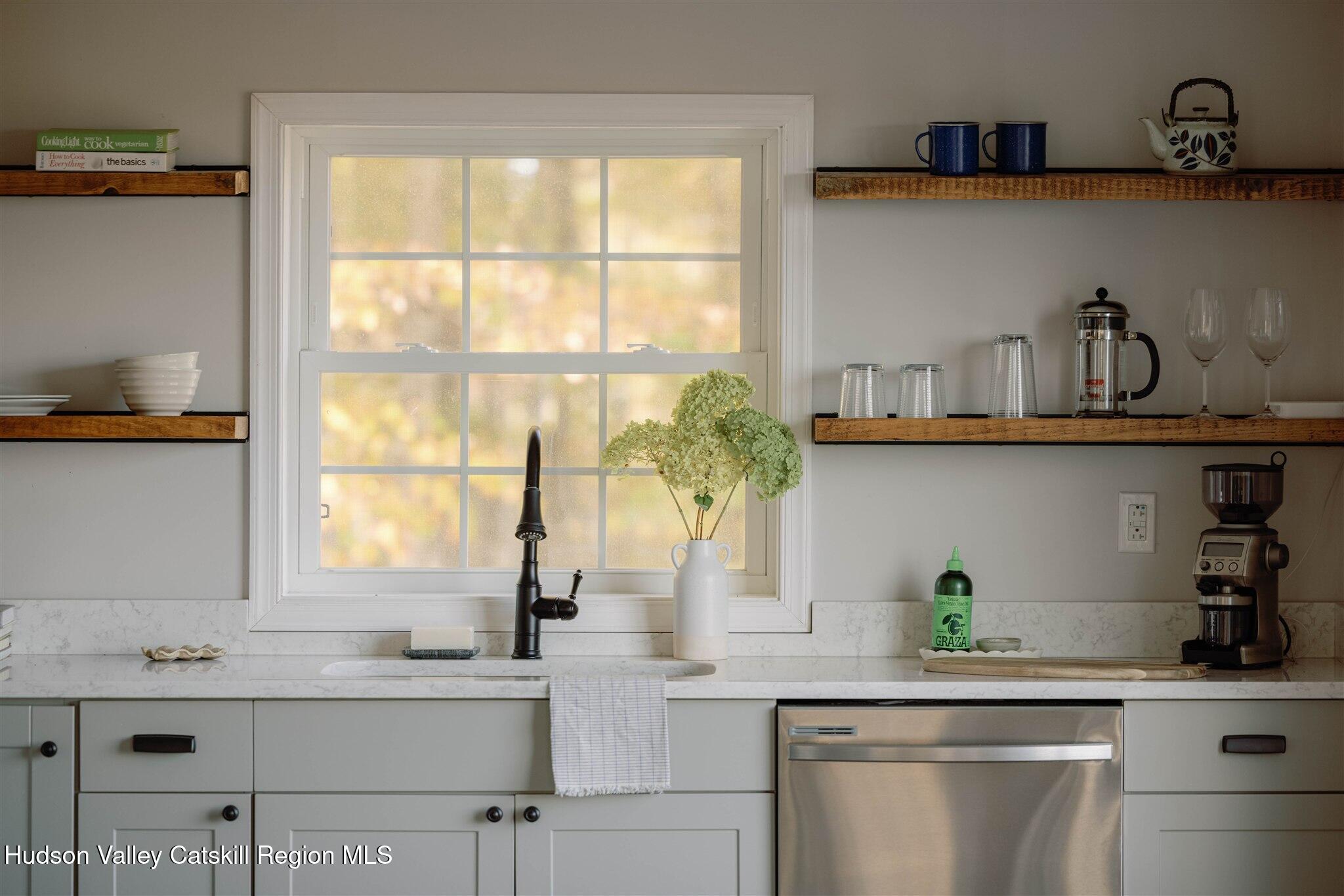 321 Mutton Hill Road Neversink, NY 12765 - Photo 4 of 25 a kitchen with appliances cabinets and a potted plant