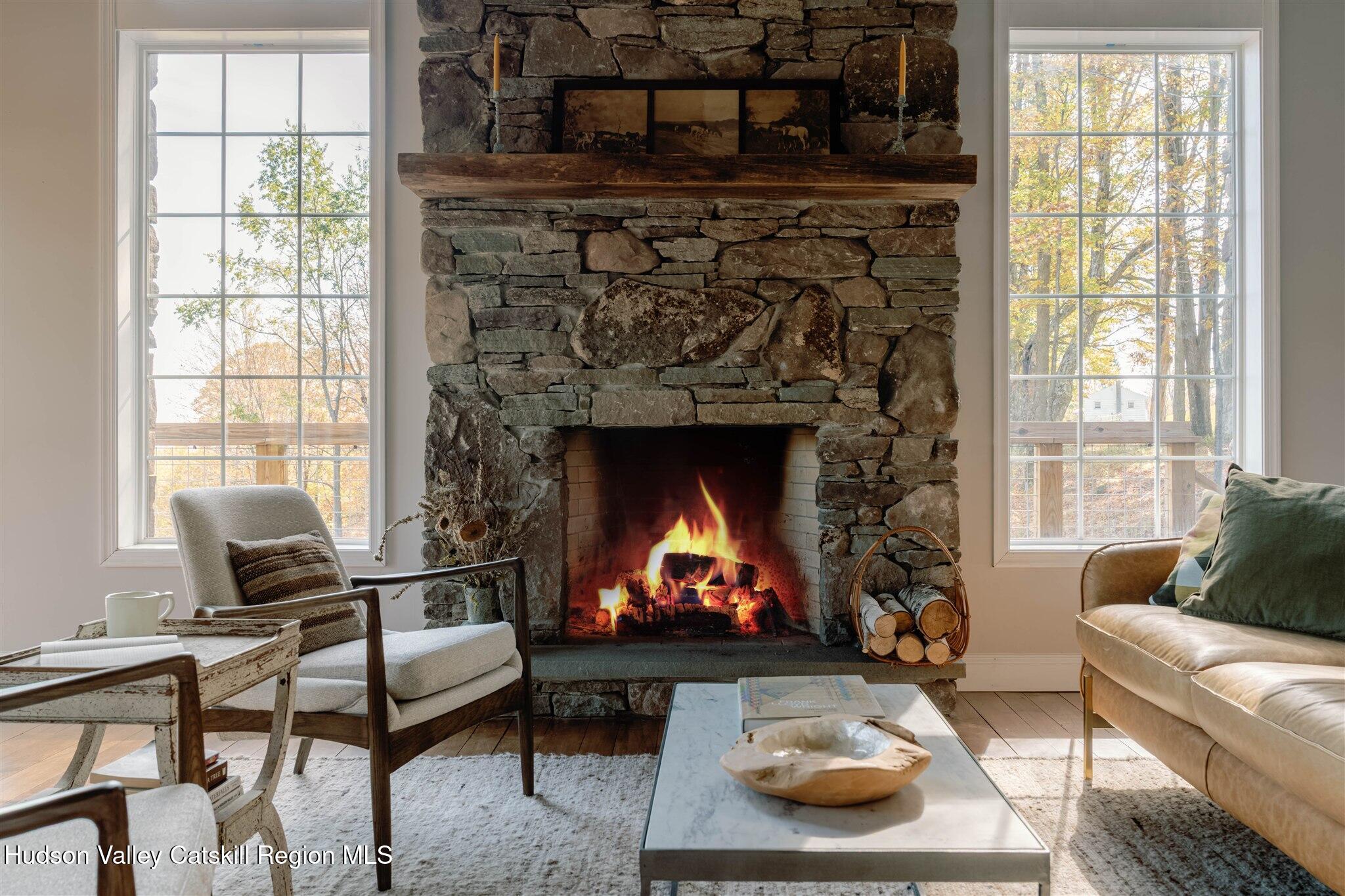321 Mutton Hill Road Neversink, NY 12765 - Photo 5 of 25 a living room with furniture and a fireplace