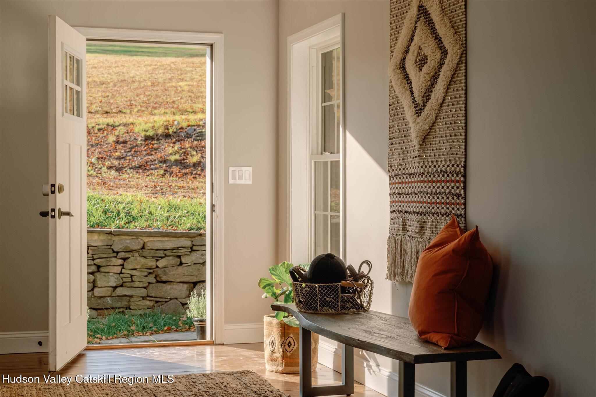 321 Mutton Hill Road Neversink, NY 12765 - Photo 8 of 25 a front view of a house with wooden floor and a window