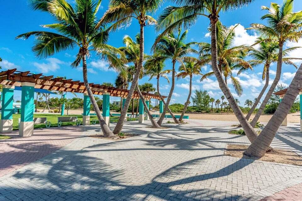 3125 Park Avenue, Unit 1 Singer Island, FL 33404 - Photo 6 of 9 a view of a street with palm trees