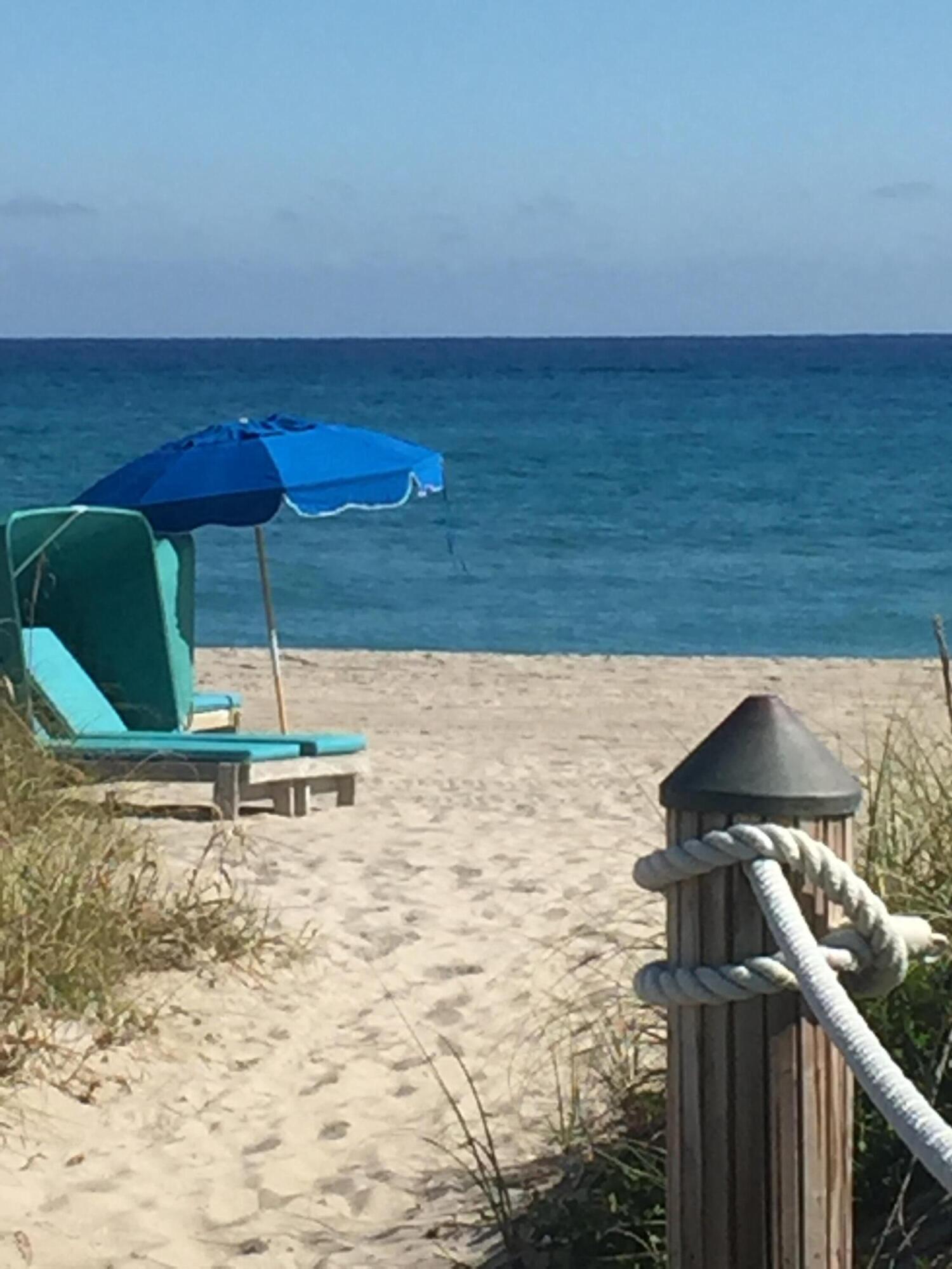 3125 Park Avenue, Unit 1 Singer Island, FL 33404 - Photo 9 of 9 a bench sitting in the middle of a yard