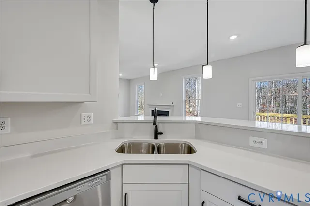 a view of kitchen and wooden floor