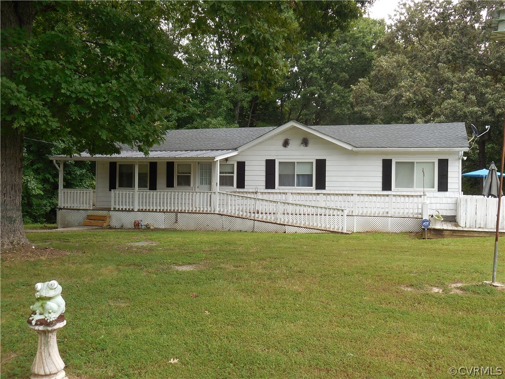 2176 Wickham Road Bumpass, VA 23024 - Photo 3 of 21 a front view of a house with a yard balcony