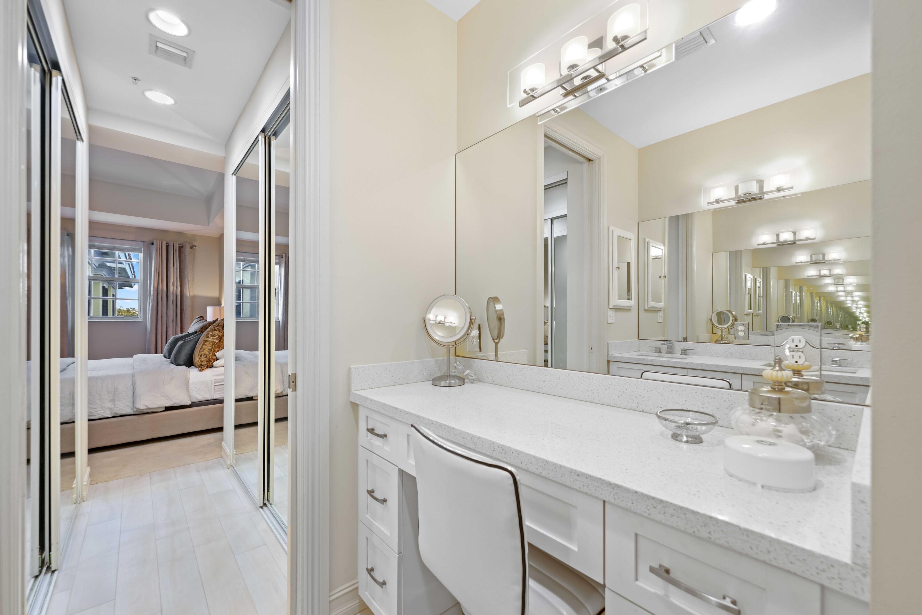 150 Northeast 6th Avenue, Unit K Delray Beach, FL 33483 - Photo 29 of 47 a bathroom with a sink double vanity and a mirror