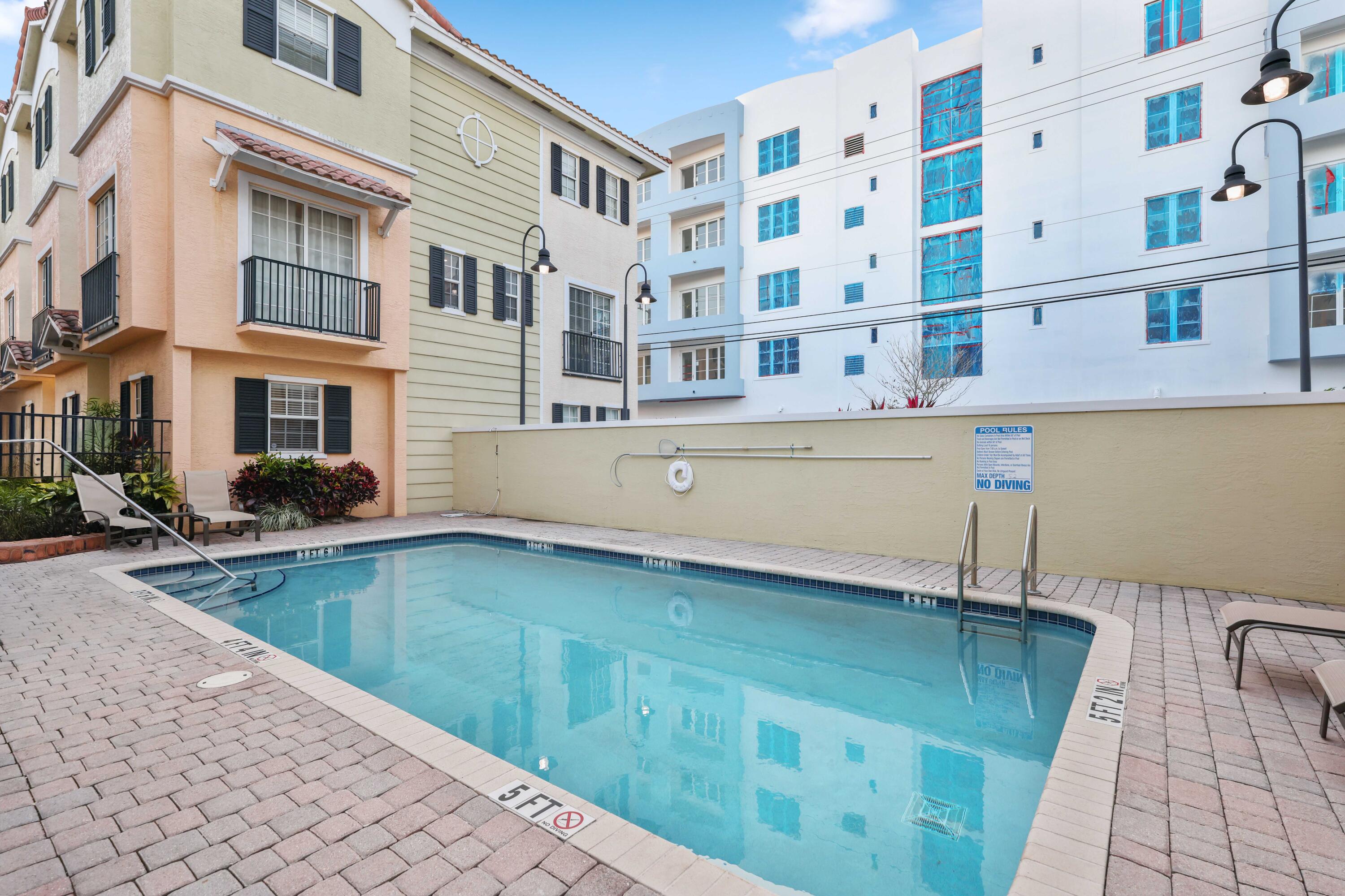 150 Northeast 6th Avenue, Unit K Delray Beach, FL 33483 - Photo 35 of 47 a view of pool with outdoor seating