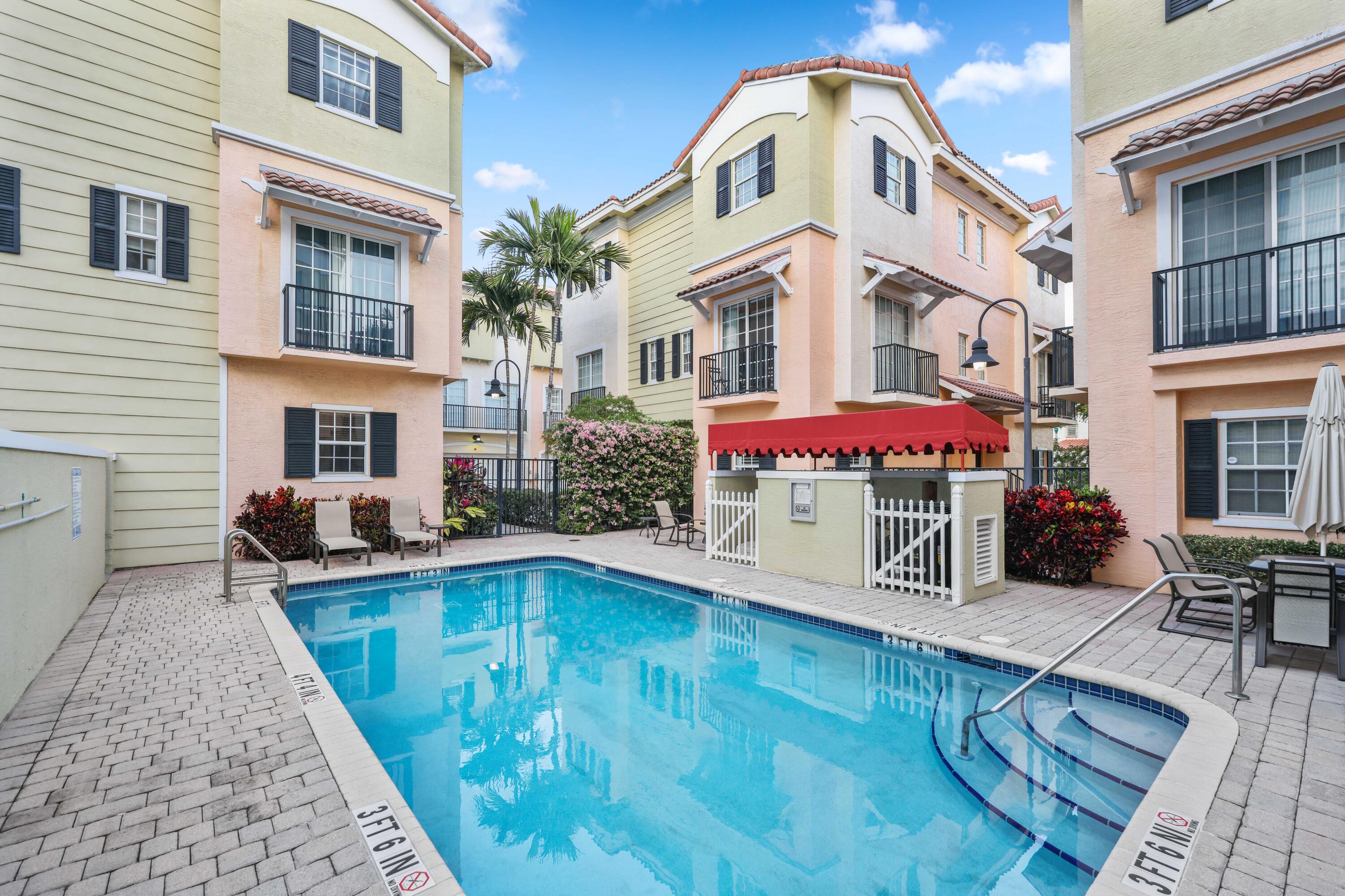 150 Northeast 6th Avenue, Unit K Delray Beach, FL 33483 - Photo 36 of 47 a front view of a house with swimming pool