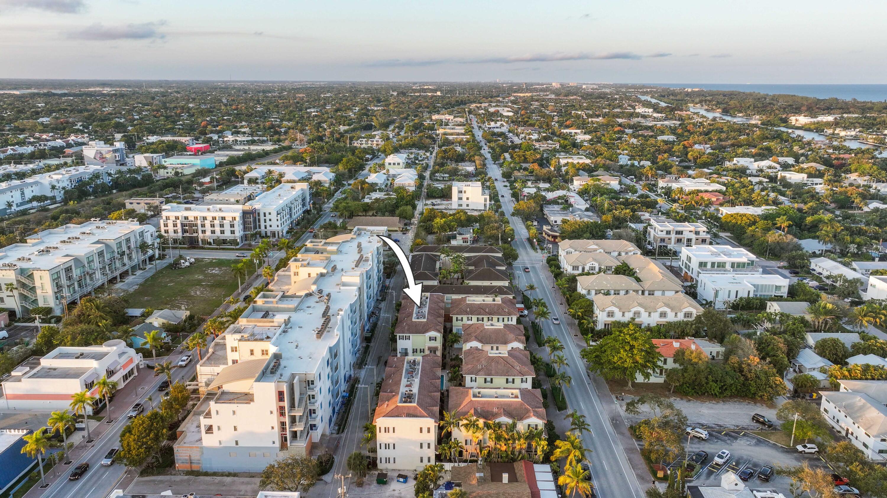 150 Northeast 6th Avenue, Unit K Delray Beach, FL 33483 - Photo 41 of 47 an aerial view of residential building with parking space