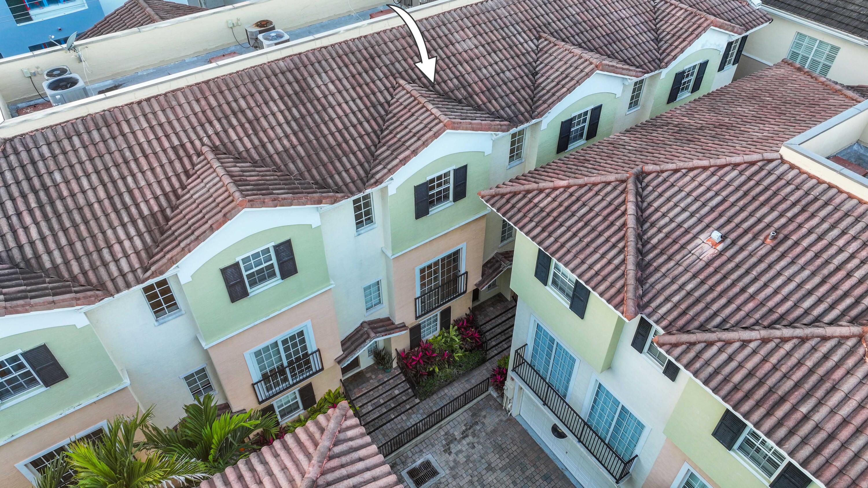 150 Northeast 6th Avenue, Unit K Delray Beach, FL 33483 - Photo 43 of 47 a view of a brick house with iron stairs