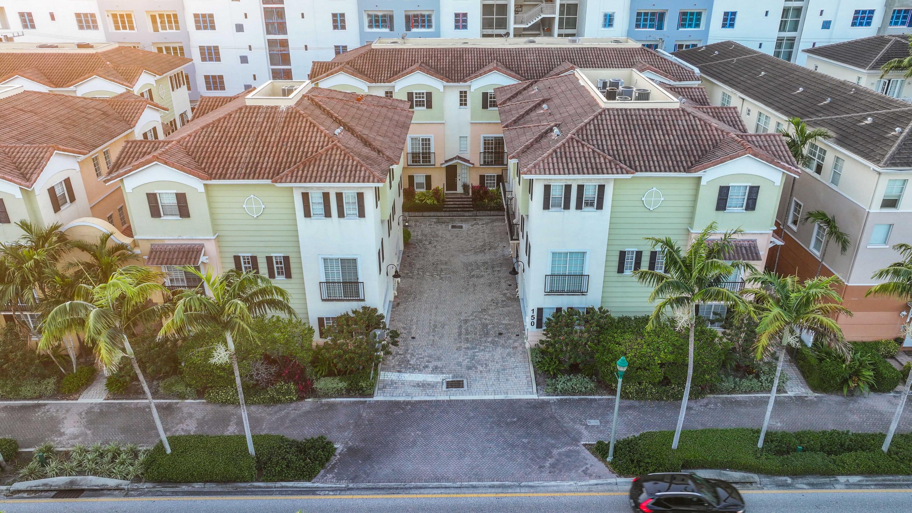 150 Northeast 6th Avenue, Unit K Delray Beach, FL 33483 - Photo 44 of 47 a front view of a house with a garden