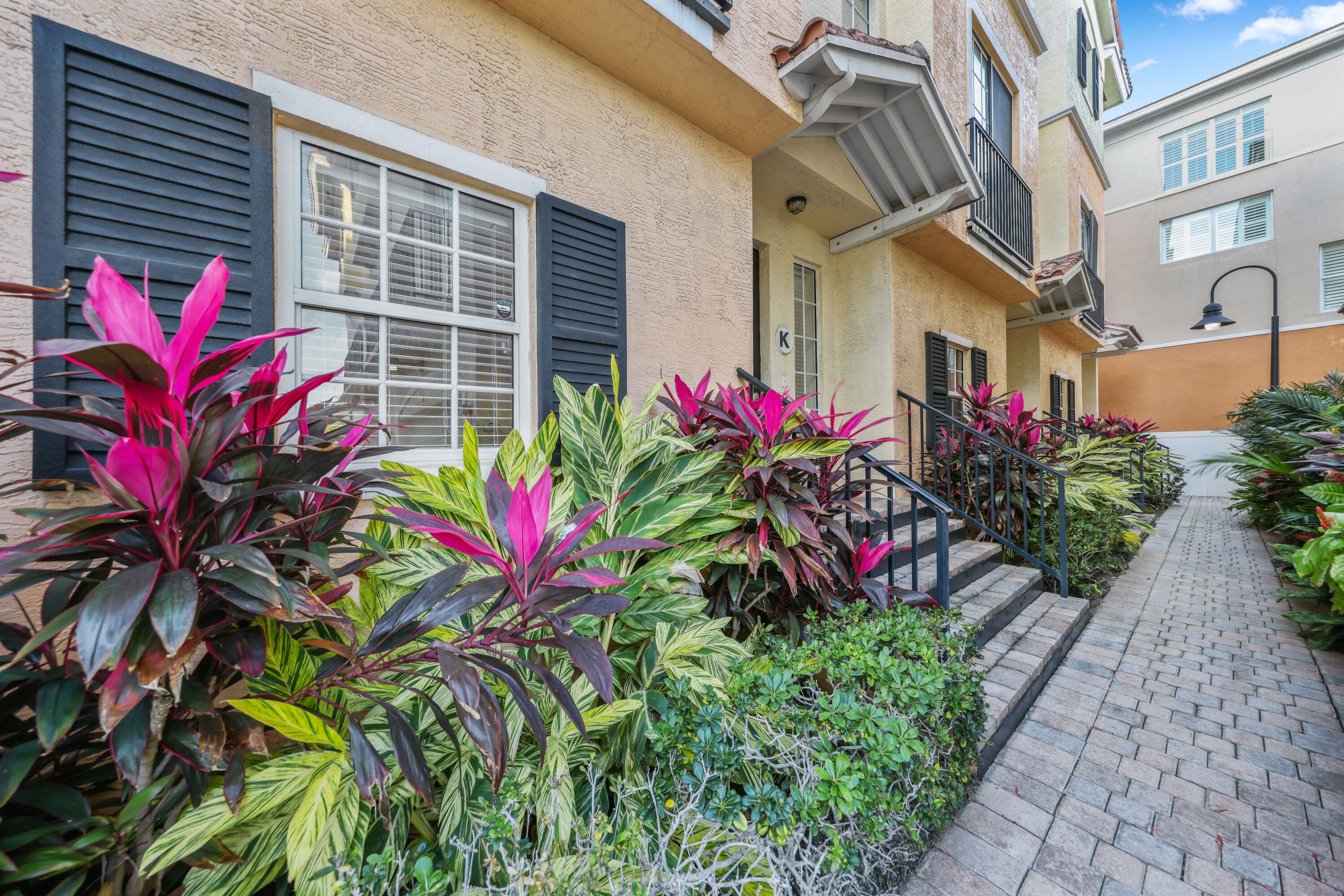 150 Northeast 6th Avenue, Unit K Delray Beach, FL 33483 - Photo 46 of 47 a view of a potted plant sitting in front of a house