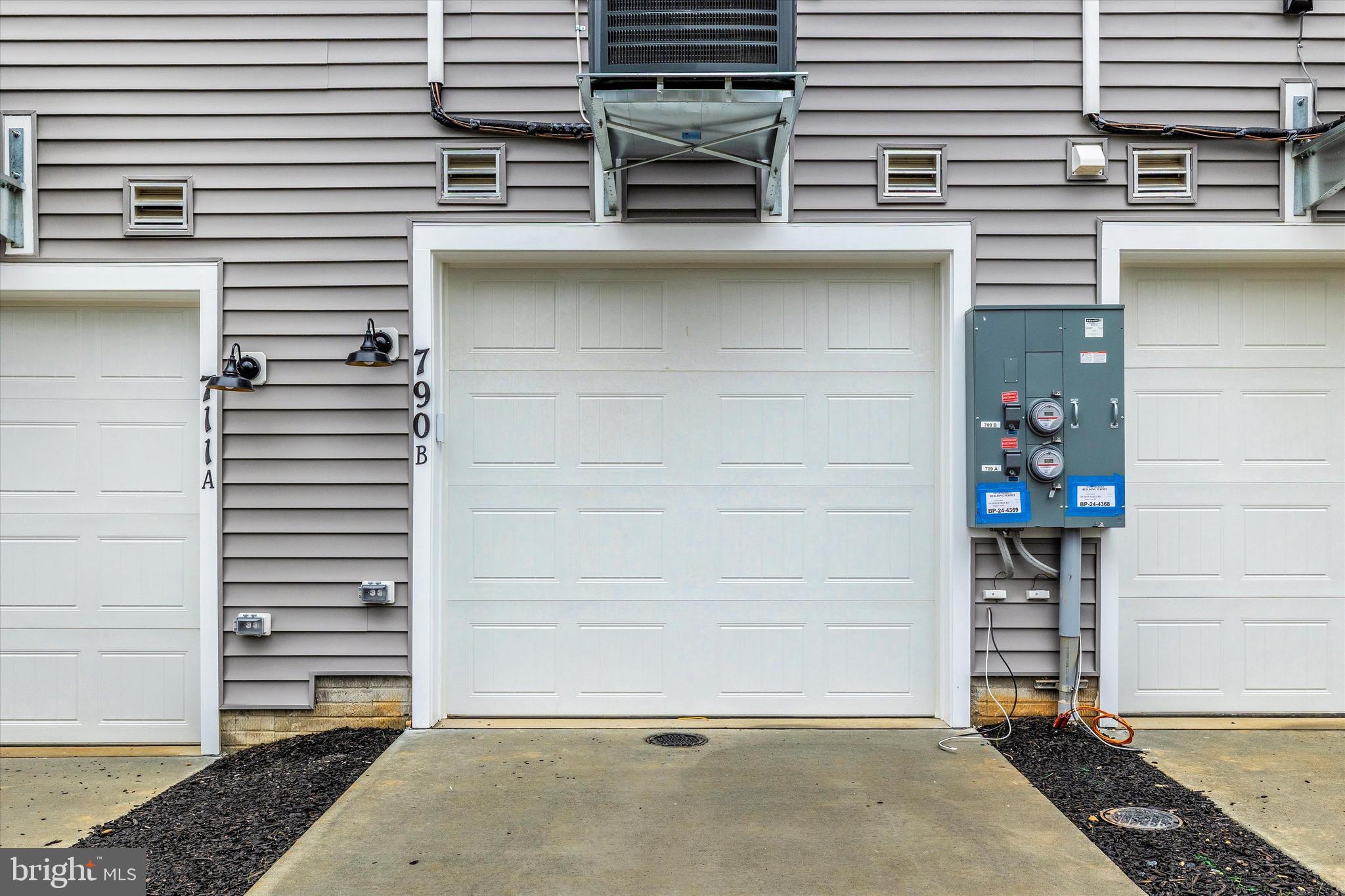 709 B Iron Frg Road, Unit 29 Frederick, MD 21702 - Photo 29 of 29 Garage and driveway.