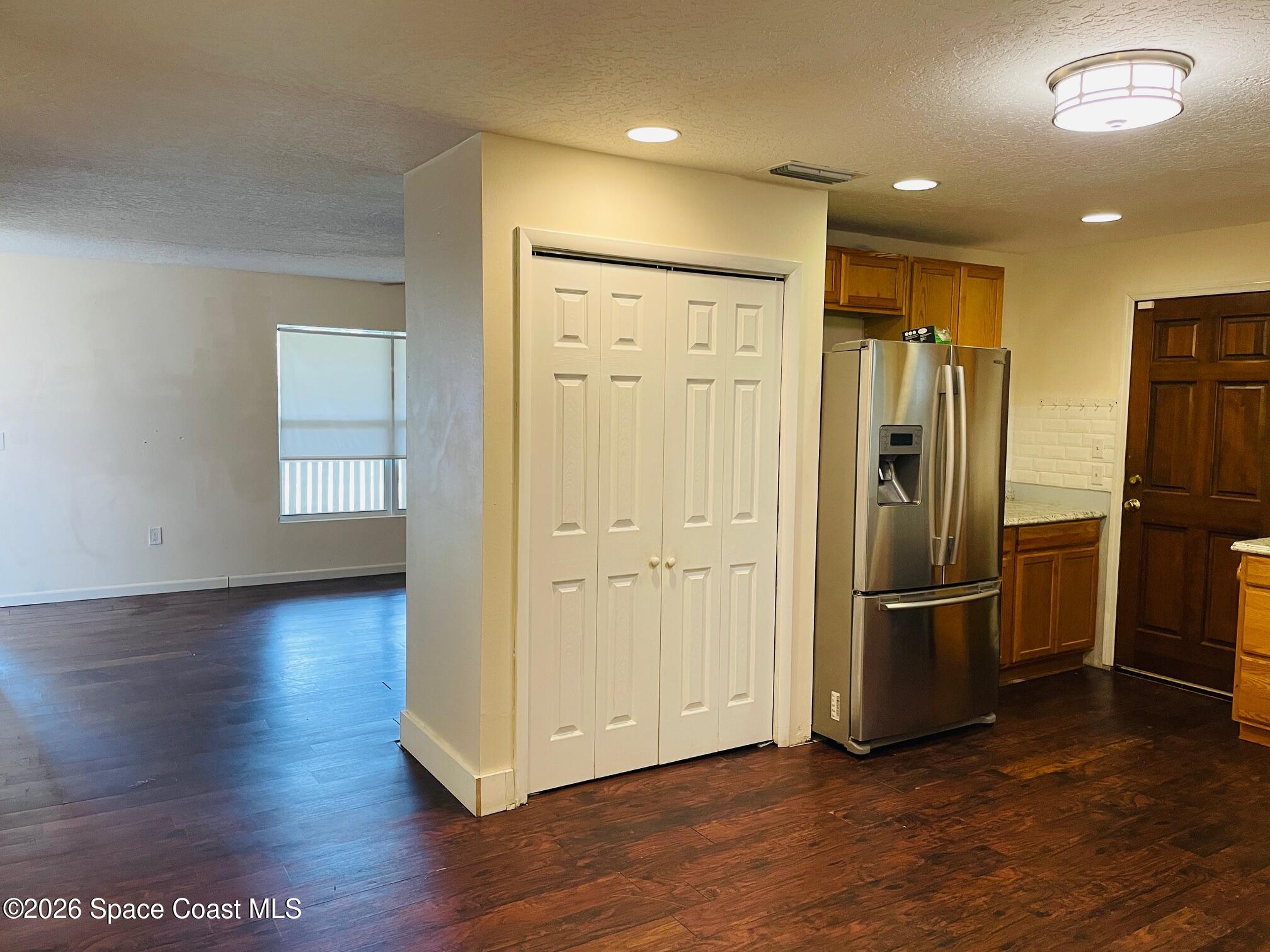 2235 Macedo Road Northeast Palm Bay, FL 32907 - Photo 11 of 23 Kitchen towards living room
