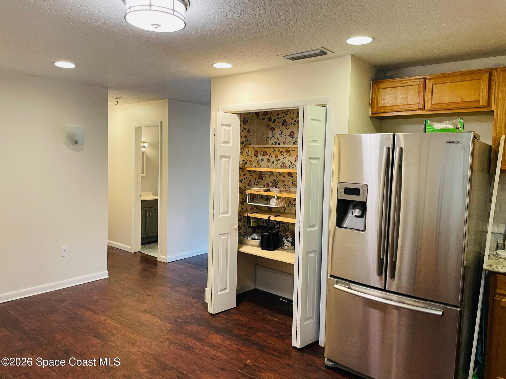 2235 Macedo Road Northeast Palm Bay, FL 32907 - Photo 12 of 23 Kitchen towards hallway