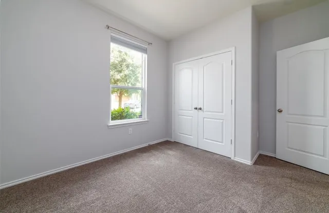 a bathroom with a granite countertop sink mirror and a bath tub