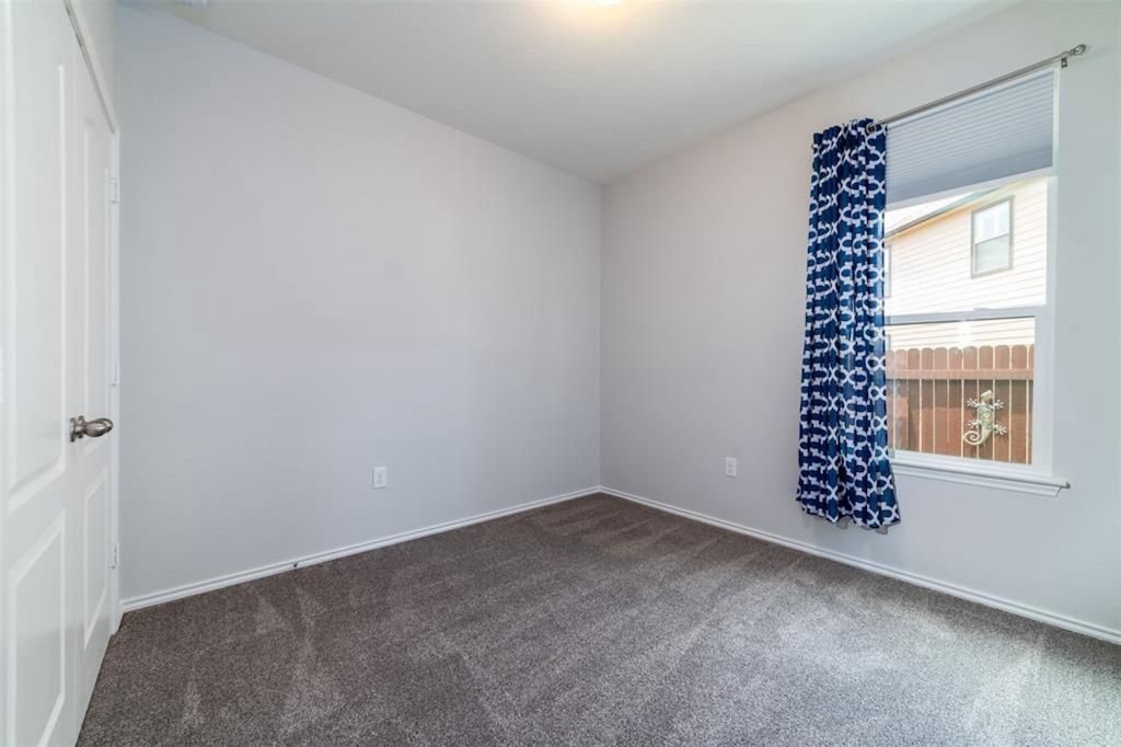 7013 Lickeen Court Austin, TX 78744 - Photo 12 of 20 an empty room with windows