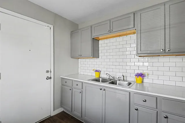 a bathroom with a sink and a shower