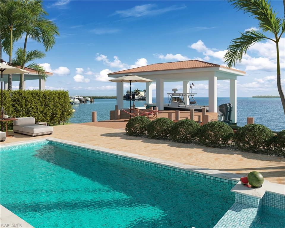 31 West Pelican Street Naples, FL 34113 - Photo 6 of 12 a view of a house with swimming pool and sitting area