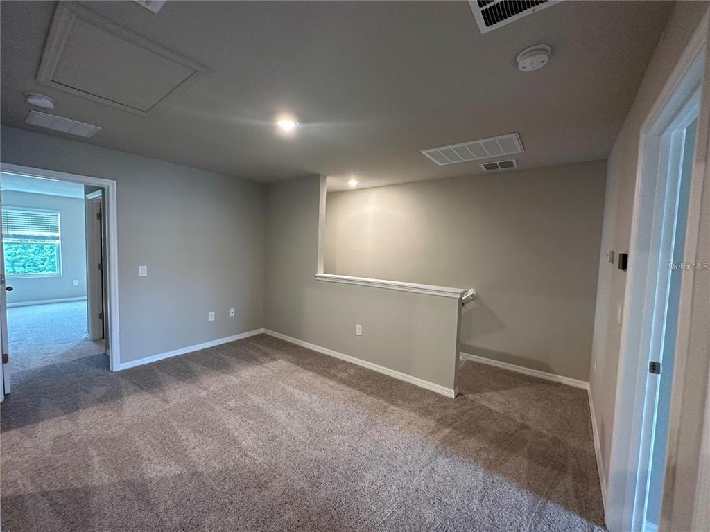 430 Legacy Loop Davenport, FL 33896 - Photo 14 of 21 an empty room with windows