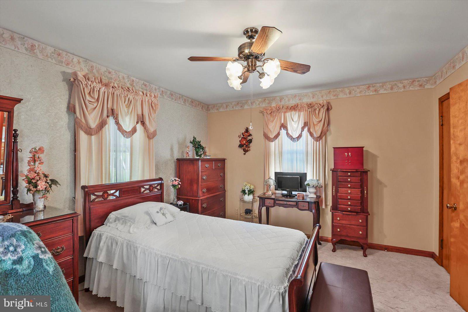 4817 East Joppa Road Perry Hall, MD 21128 - Photo 12 of 36 a bedroom with a bed and a chandelier