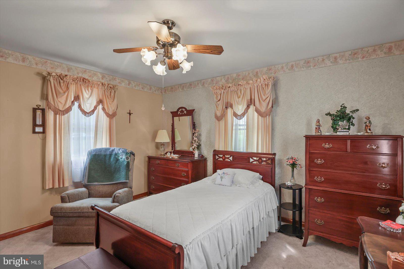 4817 East Joppa Road Perry Hall, MD 21128 - Photo 13 of 36 a bedroom with a bed and a chandelier