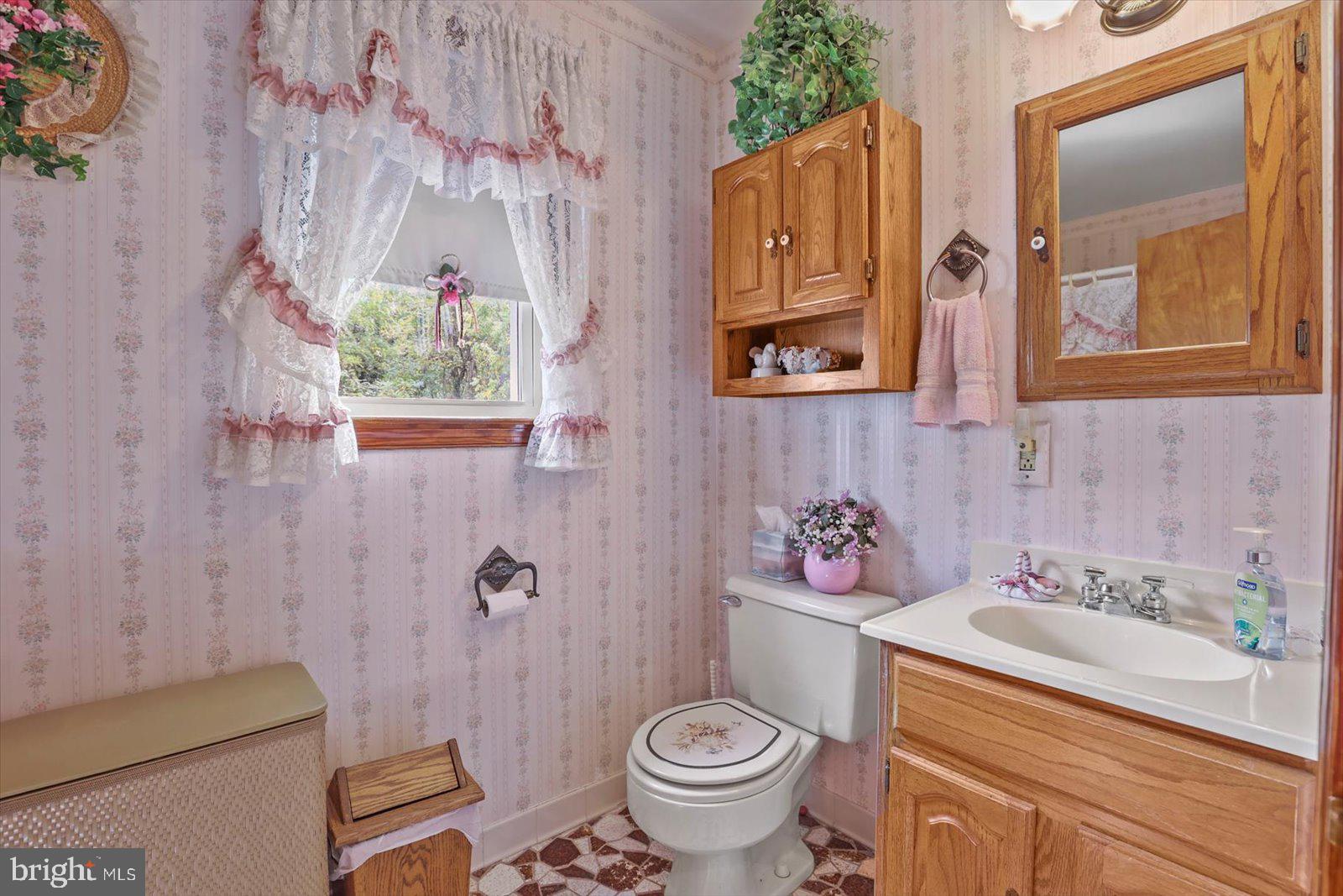 4817 East Joppa Road Perry Hall, MD 21128 - Photo 16 of 36 a bathroom with a sink toilet and shower