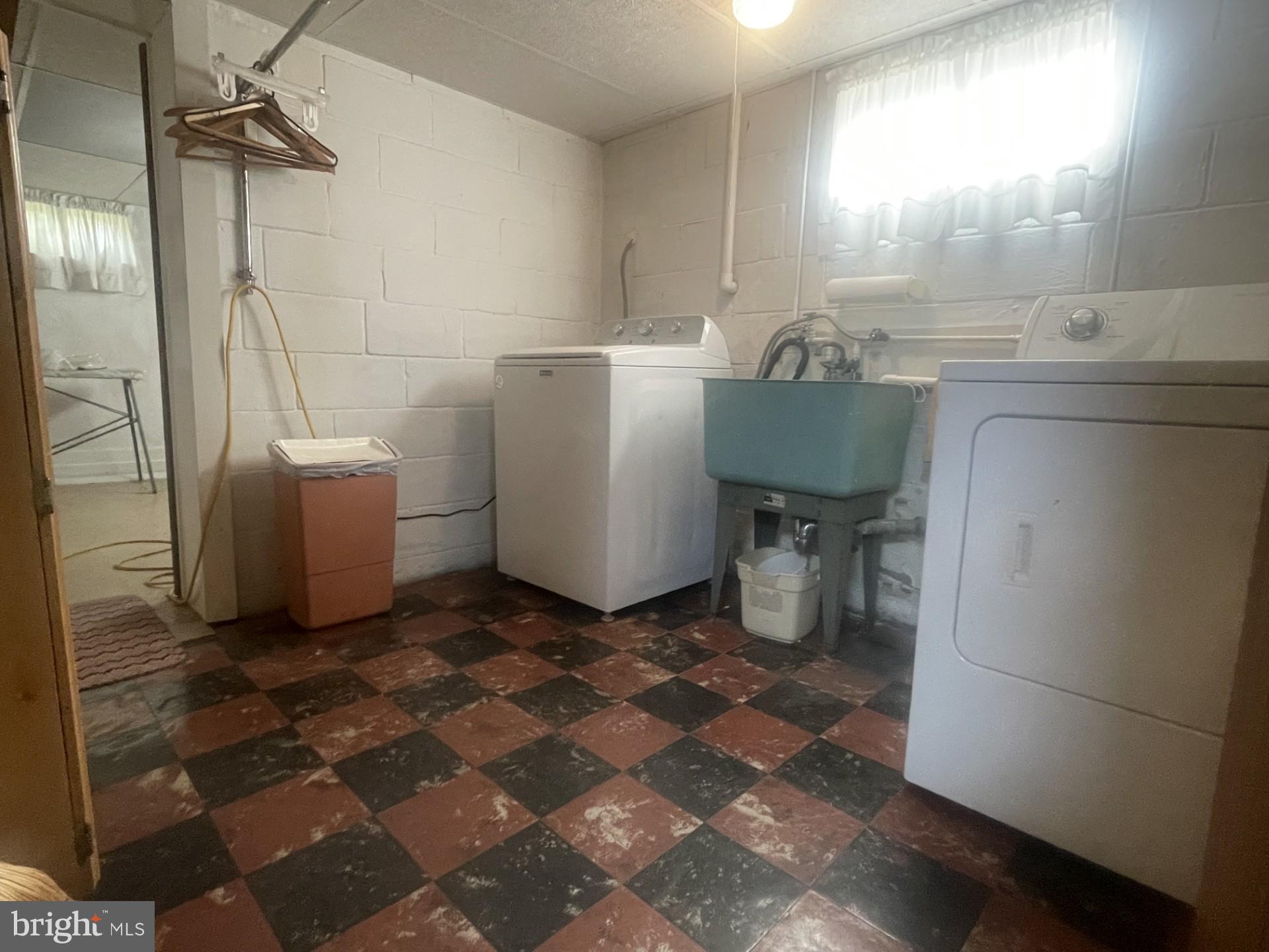 4817 East Joppa Road Perry Hall, MD 21128 - Photo 25 of 36 a bathroom with a sink a toilet and a shower
