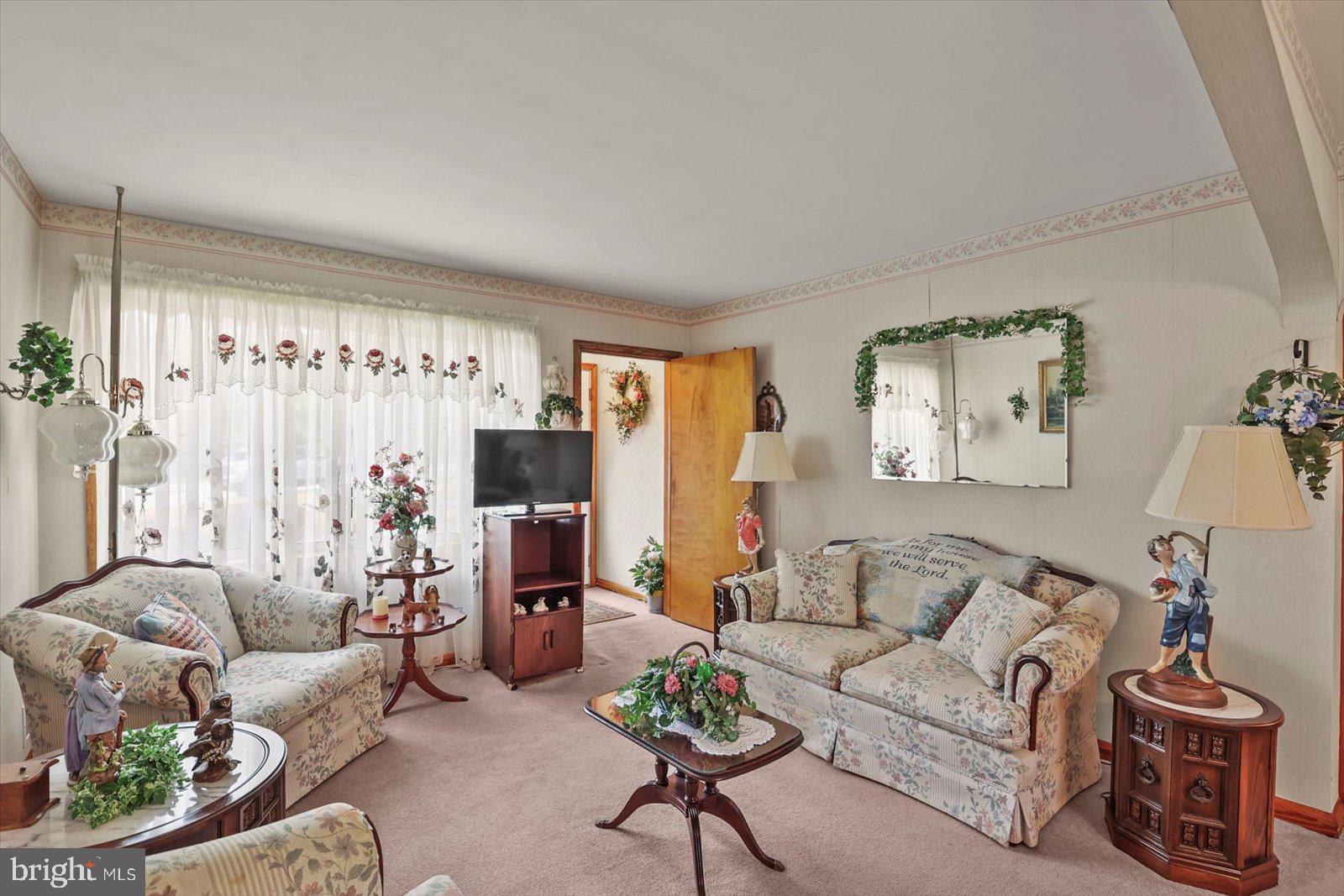 4817 East Joppa Road Perry Hall, MD 21128 - Photo 4 of 36 a living room with furniture and a large window