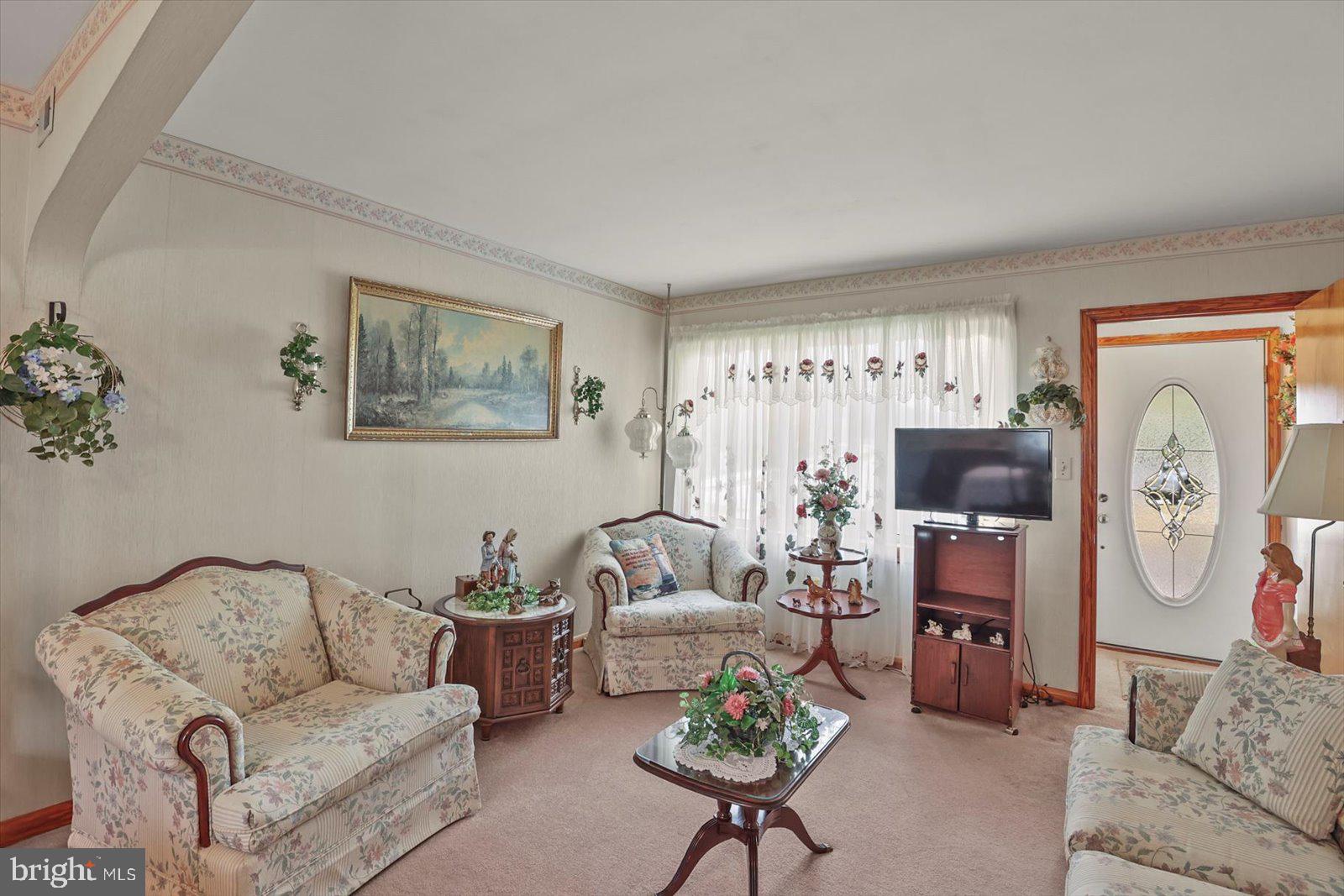 4817 East Joppa Road Perry Hall, MD 21128 - Photo 6 of 36 a living room with furniture and a couch