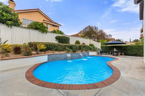 a view of a swimming pool with a patio