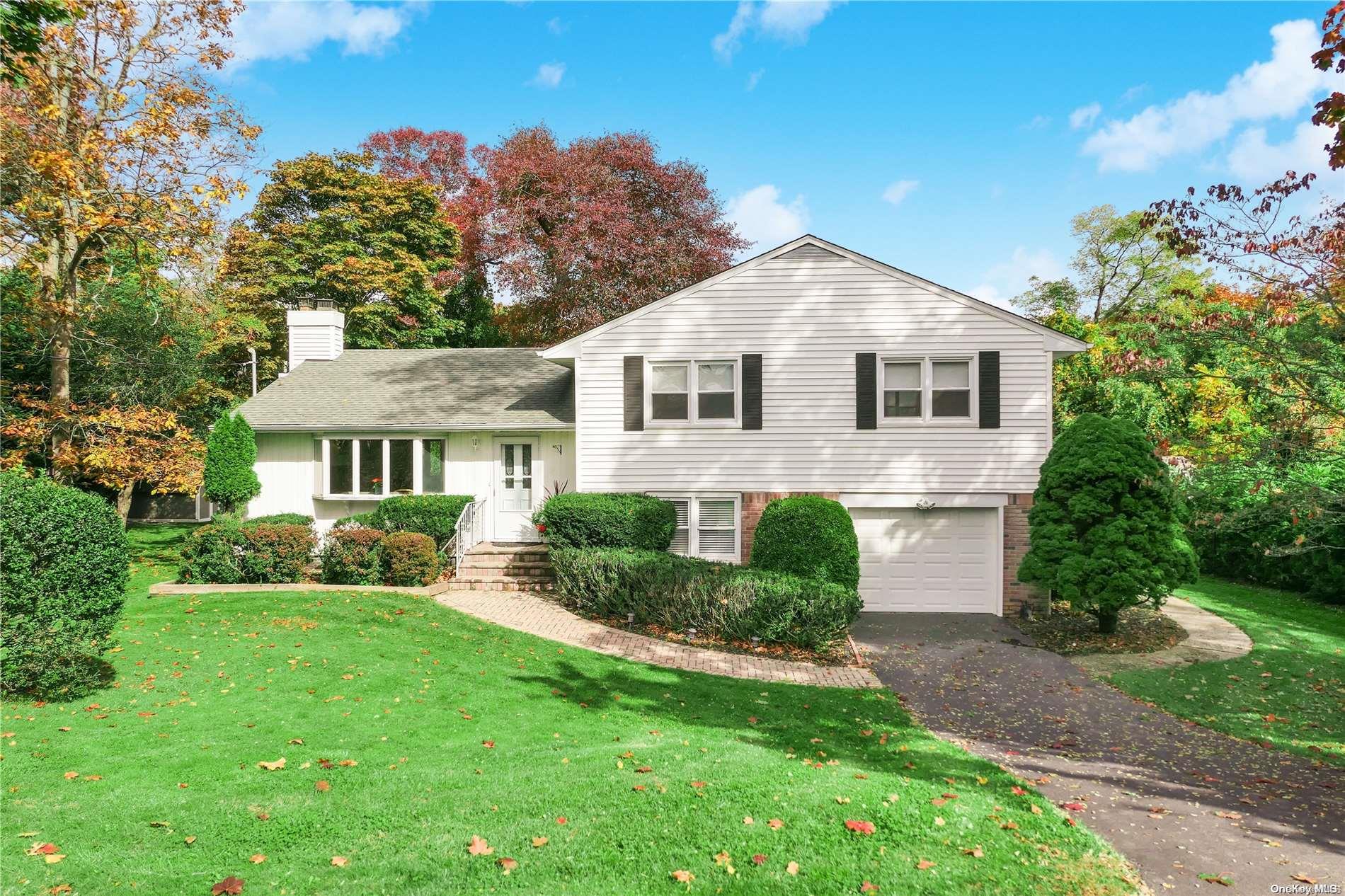 23 Highview Boulevard Brookhaven, NY 11719 - Photo 1 of 1 a front view of a house with a yard