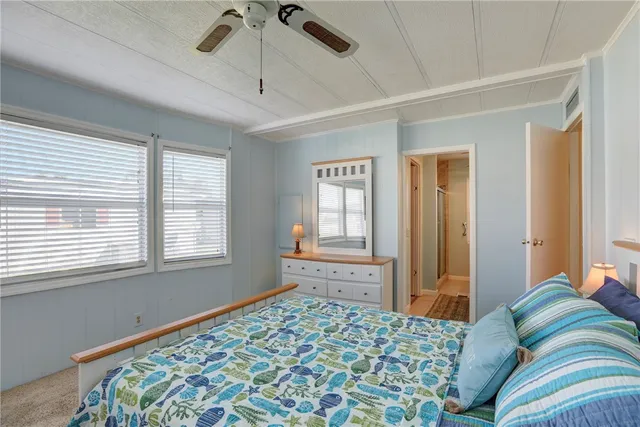 a bathroom with a granite countertop sink a toilet and a mirror