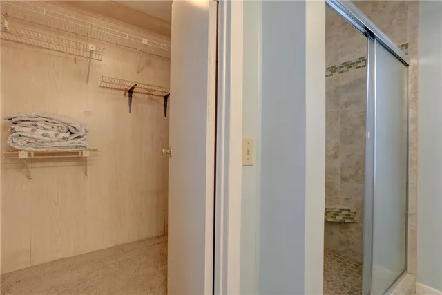 a bedroom with two beds and a window