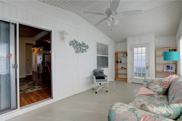 a living room with a couch and a large window
