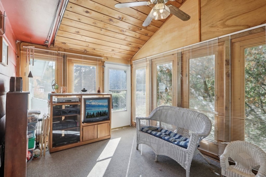 128 Harvard Road Stow, MA 01775 - Photo 14 of 36 a living room with furniture and a fireplace