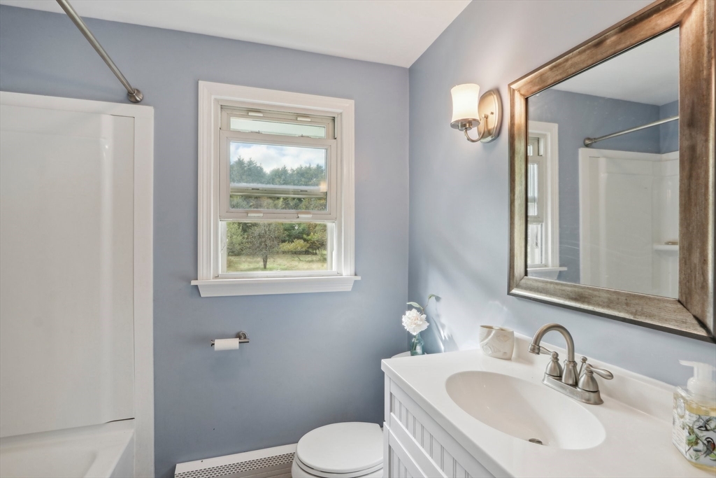 128 Harvard Road Stow, MA 01775 - Photo 15 of 36 a bathroom with a sink toilet and a mirror