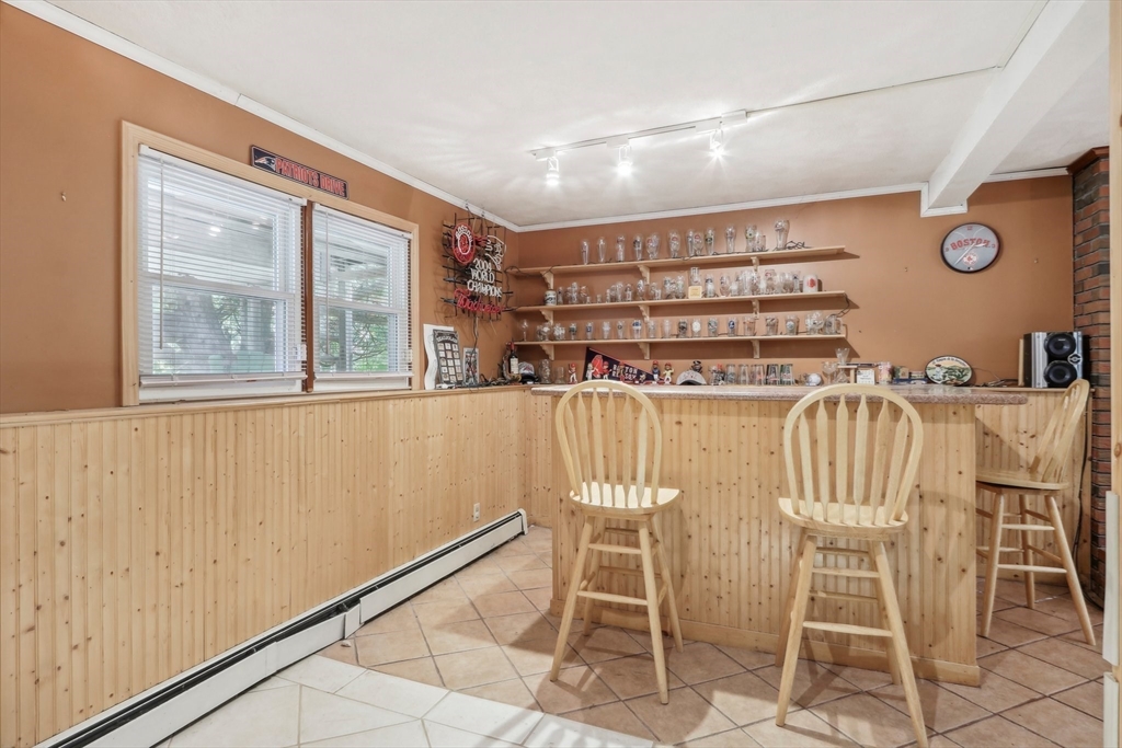 128 Harvard Road Stow, MA 01775 - Photo 19 of 36 a dining room with furniture and window