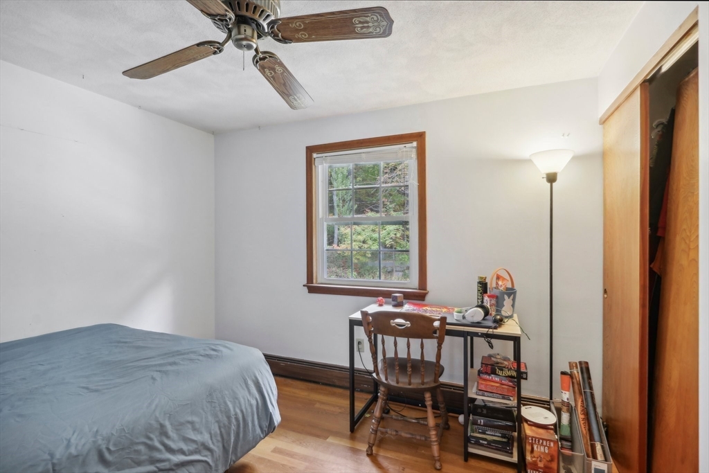 128 Harvard Road Stow, MA 01775 - Photo 22 of 36 a bedroom with a bed and a window