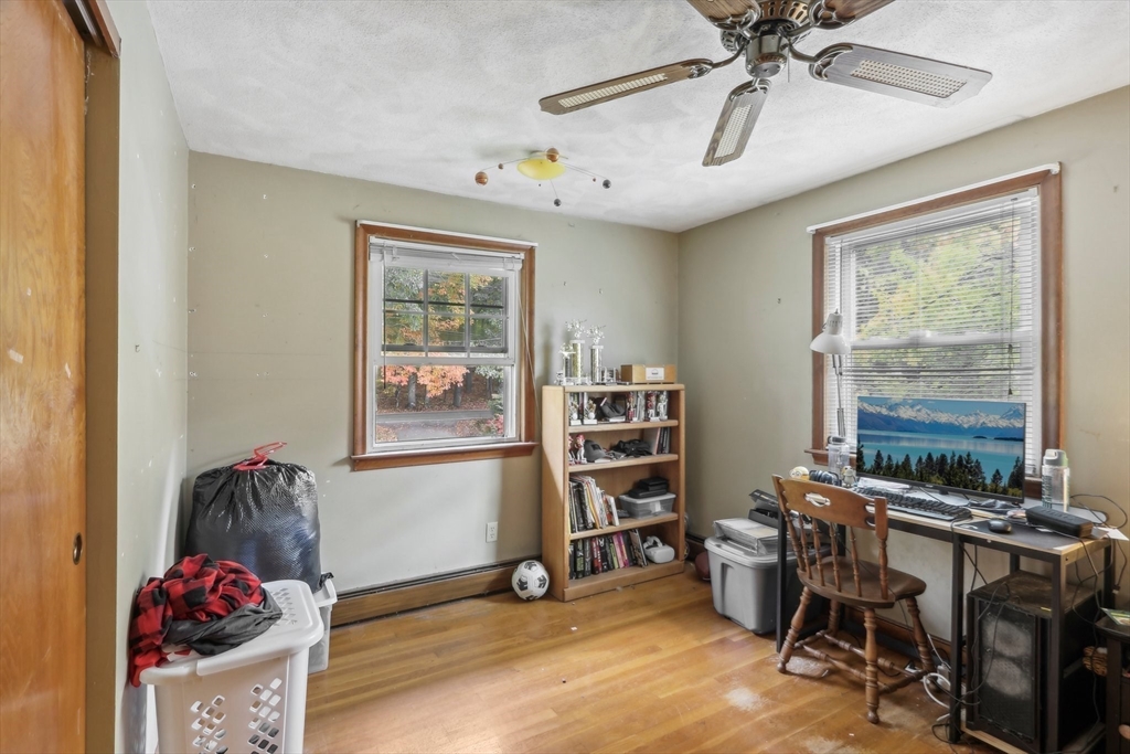 128 Harvard Road Stow, MA 01775 - Photo 24 of 36 a view of a workspace with furniture and a window