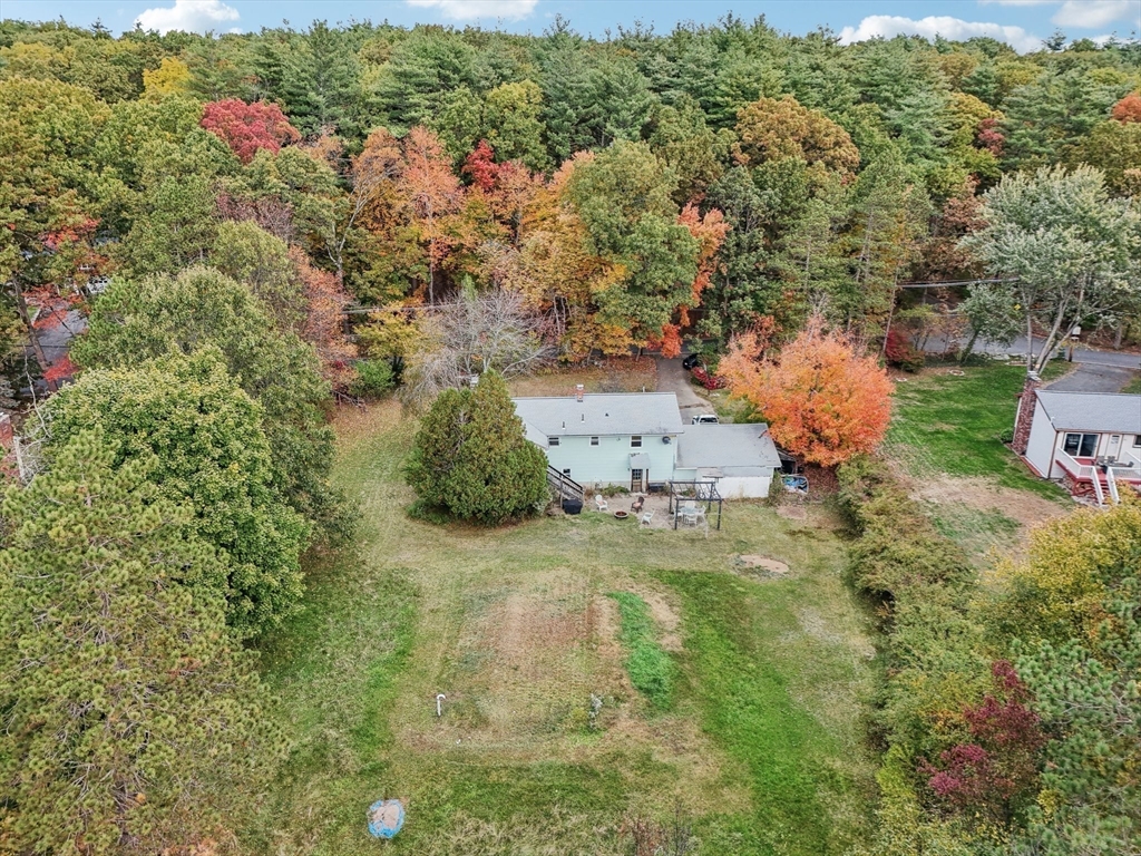 128 Harvard Road Stow, MA 01775 - Photo 30 of 36 an aerial view of a house with a yard