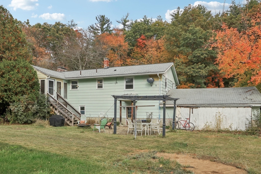 128 Harvard Road Stow, MA 01775 - Photo 33 of 36 a view of a house with a yard