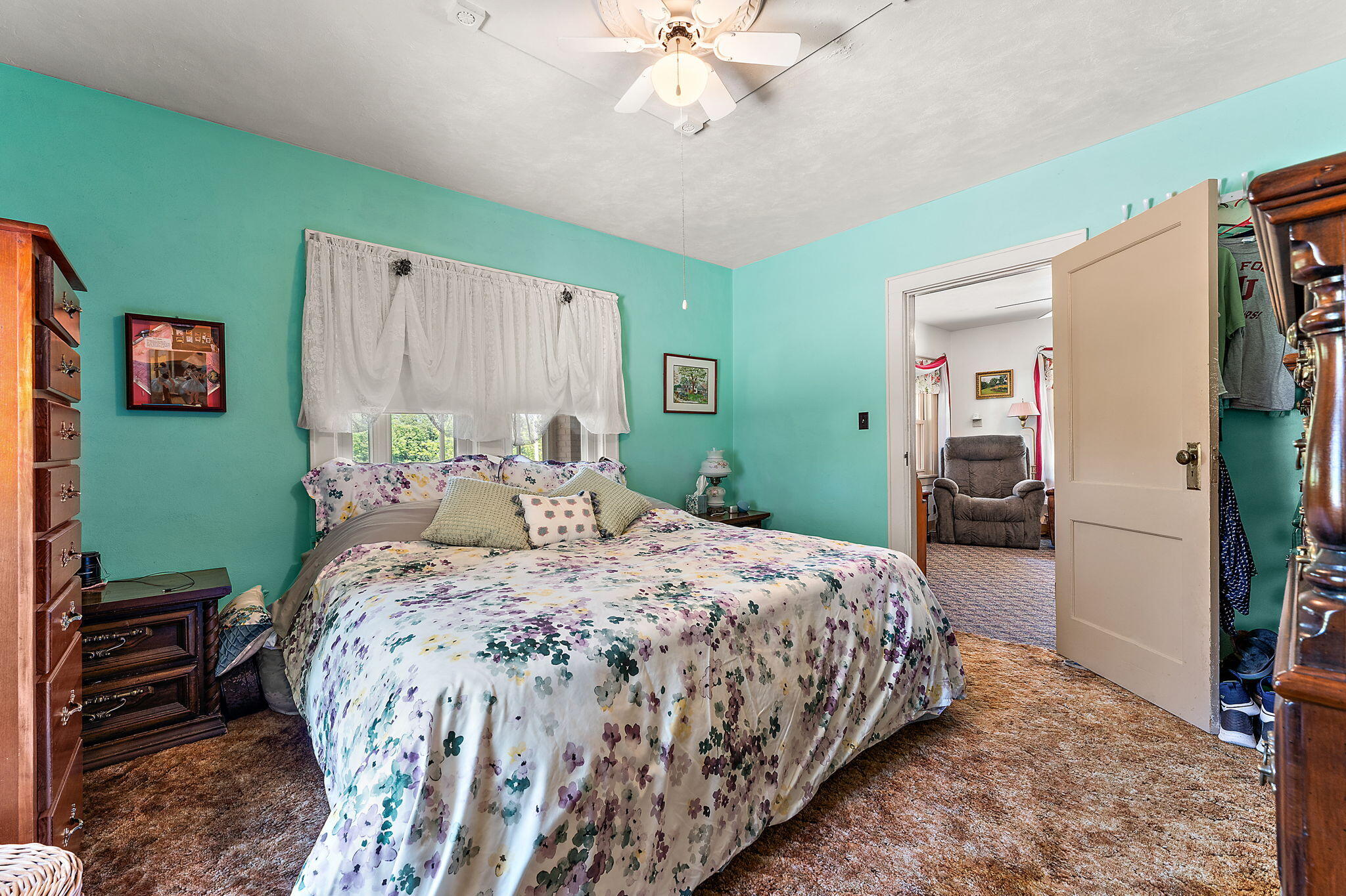 138 McClung Road La Porte, IN 46350 - Photo 12 of 50 a bedroom with a bed and a chandelier