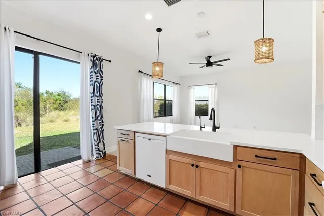 a spacious bathroom with a shower sink and mirror