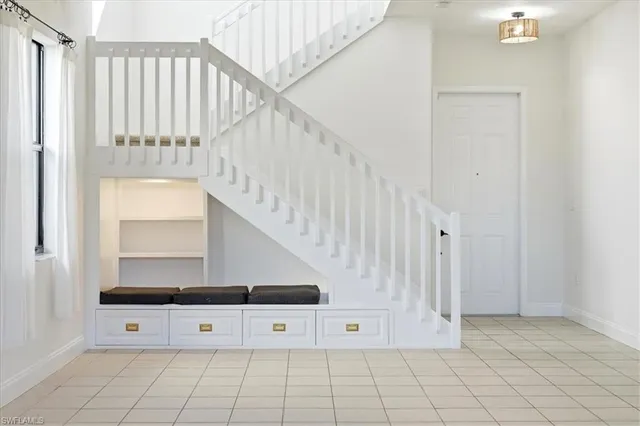 a view of front door with stairs