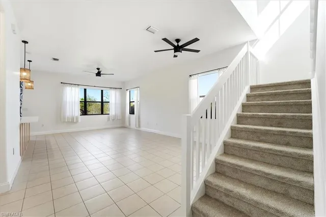 a view of an entryway with wooden floor and windows