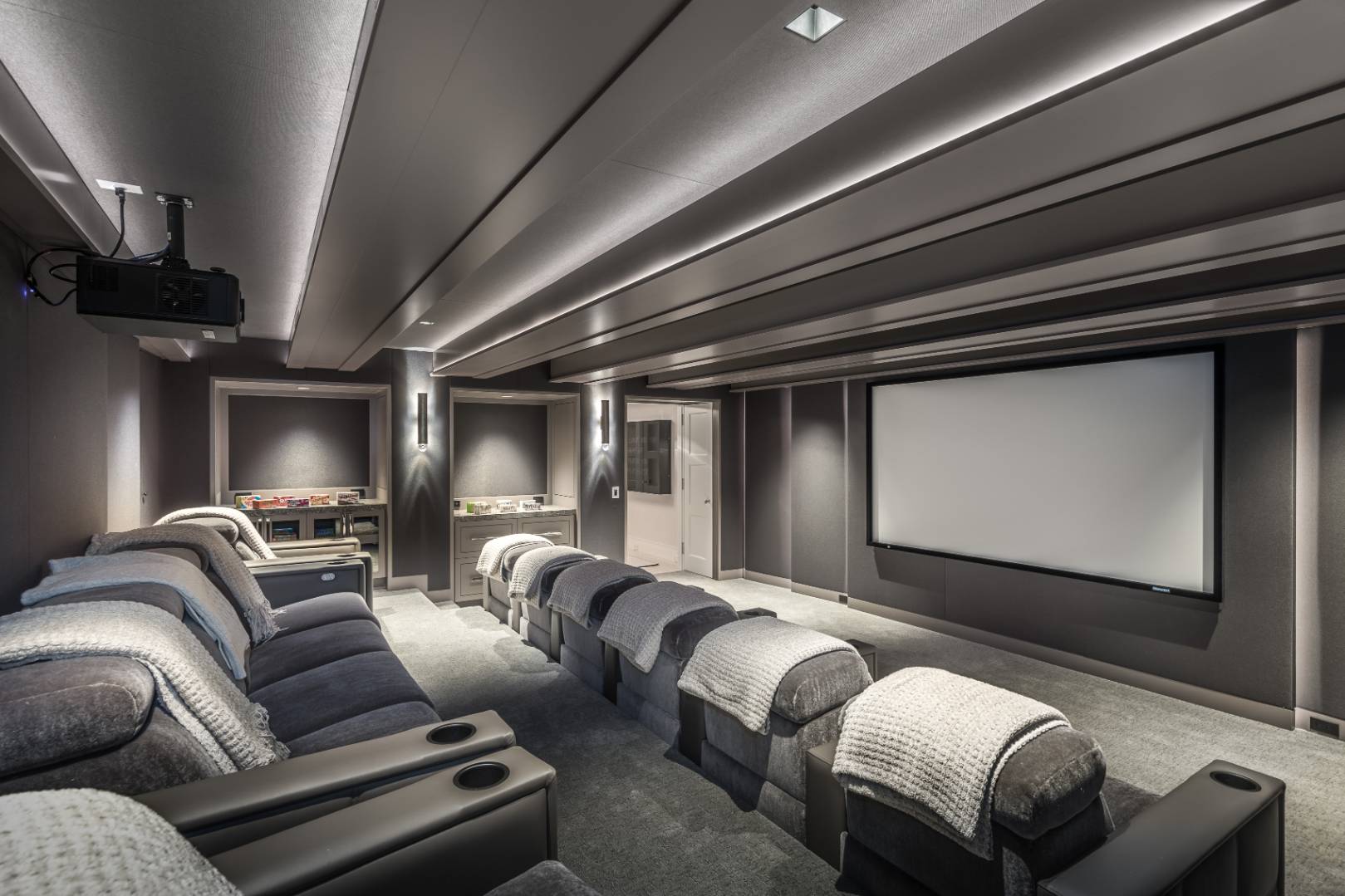 8 Hither Lane East Hampton, NY 11937 - Photo 29 of 38 a media room with lots of chairs and a projector screen