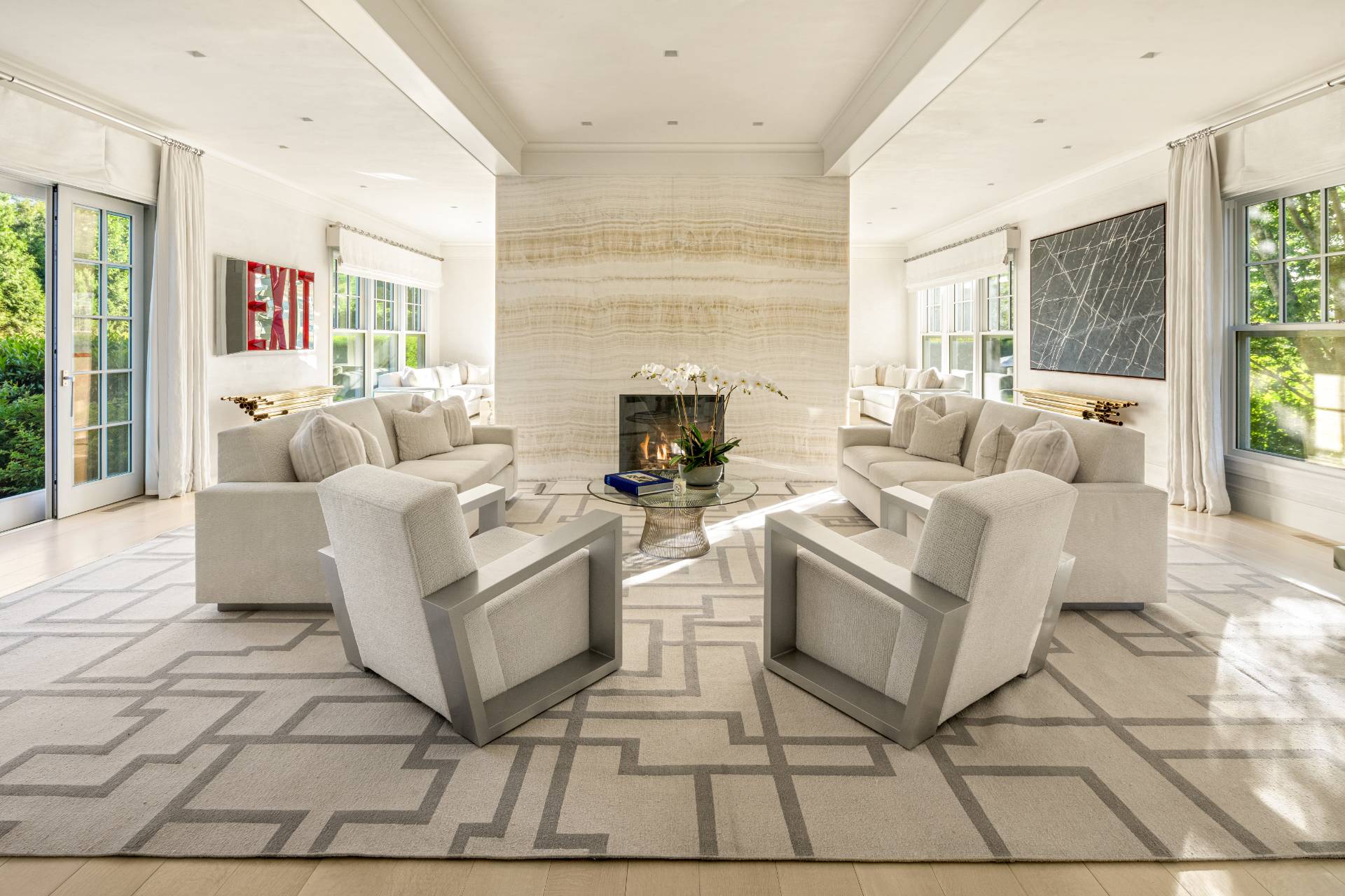 8 Hither Lane East Hampton, NY 11937 - Photo 3 of 38 a living room with furniture and a fireplace